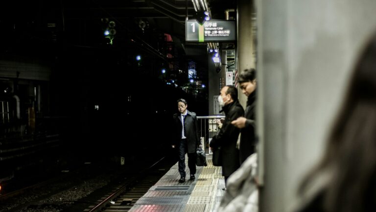 A businessman on a Japanese train platform